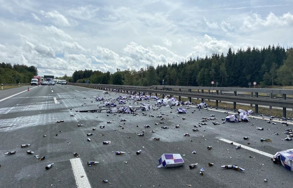 Weaving, crashing, and a shower of bottles: A 40-ton truck causes stress ...