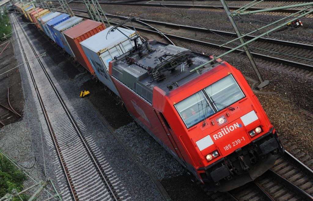 Life-threatening shortcut: Man crawls under stationary freight train - | ...